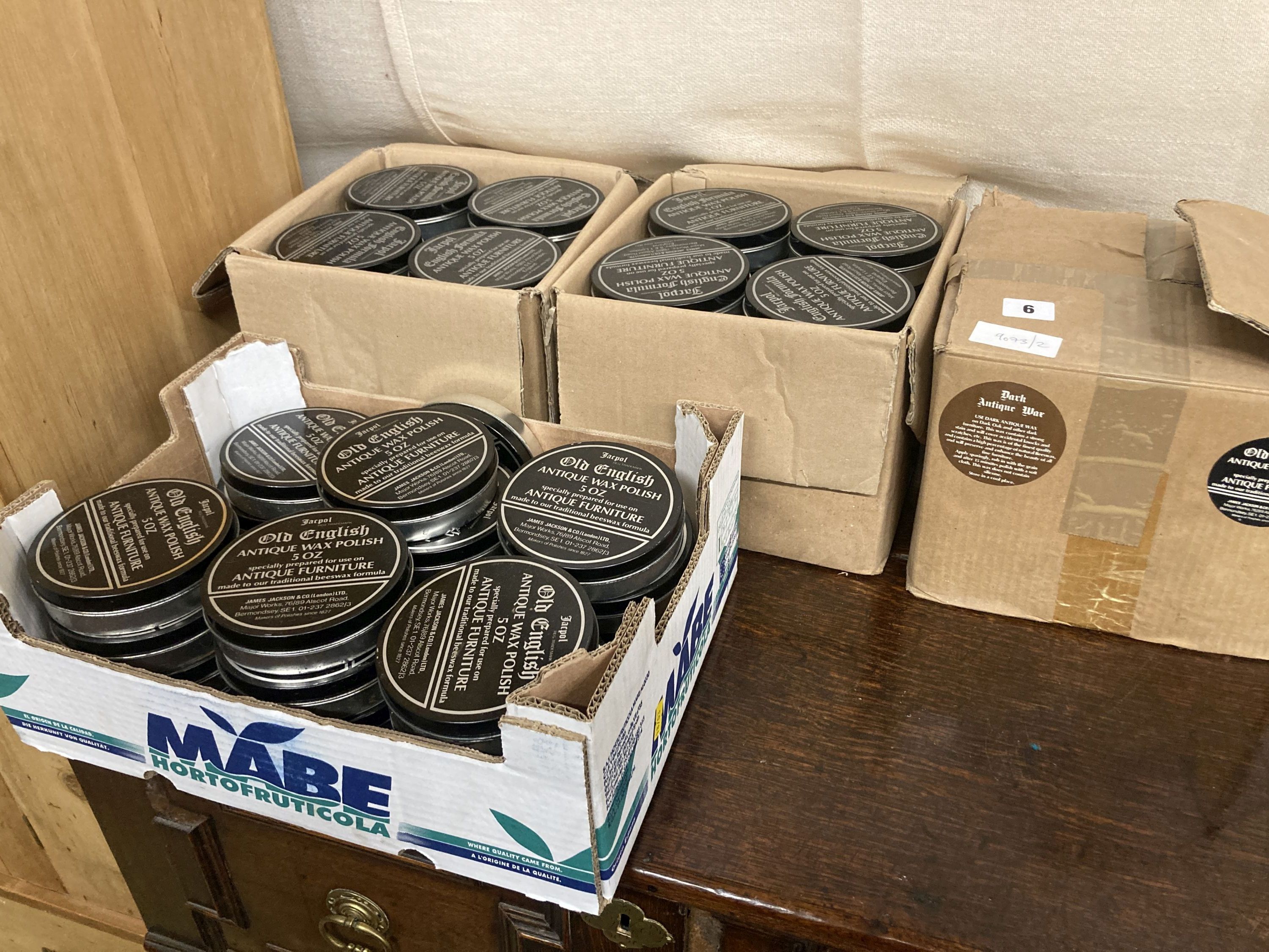 Approximately 96 tins of Old English antique wax polish- dark